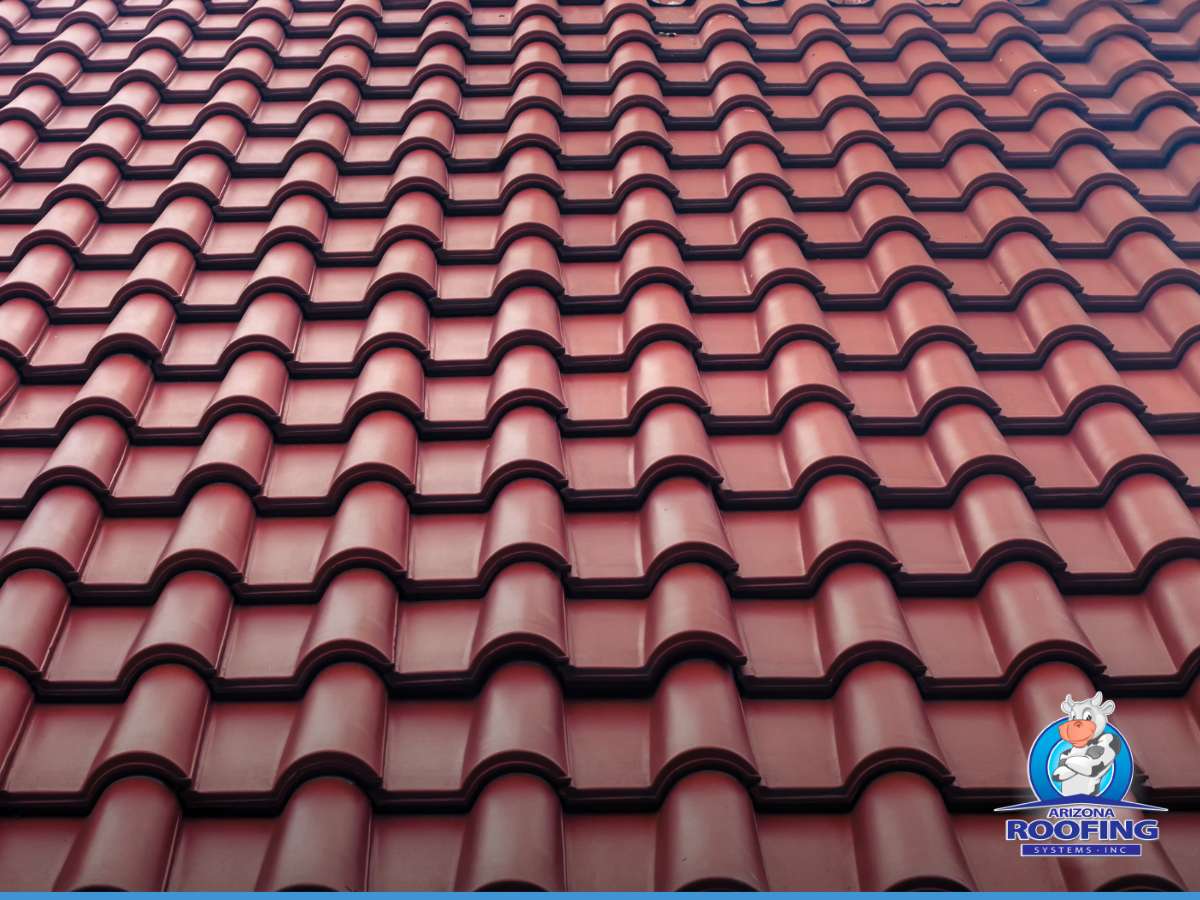 lose-up view of a section of clay roof tiles in a repeating pattern, with a logo for 'Arizona Roofing Systems' in the corner.