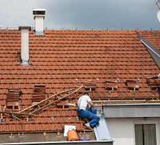 Professional residential tile roofing installation in progress