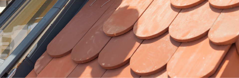 Clay tile roof installation showcasing timeless, classic design